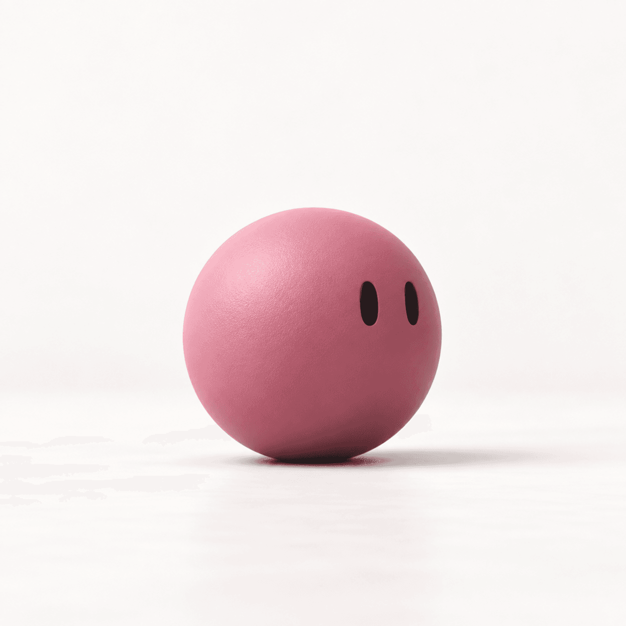 La esfera rosa con ojos mira de reojo